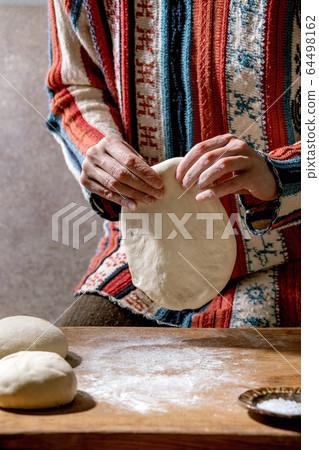 Dough for pizza 64498162