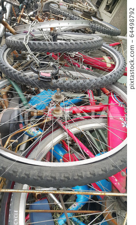 Old bicycles stacked up Old bicycles stacked up 64498792