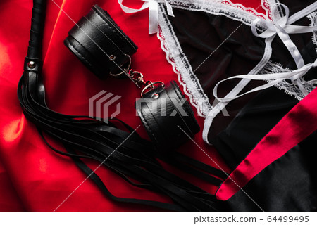 BDSM sex toys for domination and submission. Whip with handcuffs BDSM sex toys for domination and submission. Whip with handcuffs 64499495