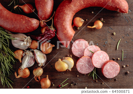 Salami with rosemary, onion, garlic and pepper on Salami with rosemary, onion, garlic and pepper on 64500871