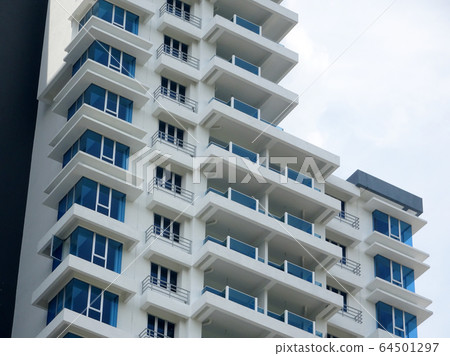 KUALA LUMPUR, MALAYSIA -JUNE 20, 2017: High rise residential apartment building with modern facade design. Apartment housing popular especially in the urban area in Malaysia.  64501297