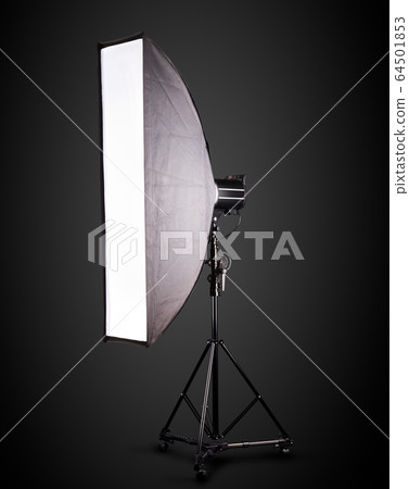 Photo studio lighting stands with flash and softbox isolated on the black. 64501853