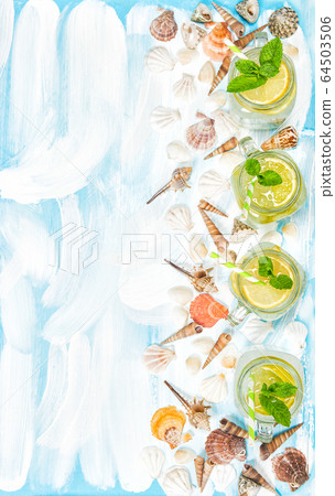 Drink with lime lemon mint ice lemonade sea shells Drink with lime lemon mint ice lemonade sea shells 64503506