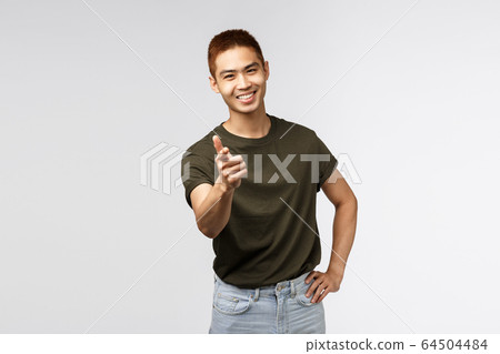 Nice work, good job. Portrait of young cheerful asian man pointing finger at camera and smiling satisfied, congratulate person with win, praise great choice, peeking or rectuiting for job Nice work, good job. Portrait of young cheerful asian man pointing finger at camera and smiling satisfied, congratulate person with win, praise great choice, peeking or rectuiting for job 64504484