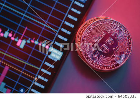 Cryptocurrency chart and bitcoin. Close-up photo. T Cryptocurrency chart and bitcoin. Close-up photo. T 64505335