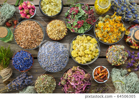 Bowls of dry healthy medicinal herbs. Top view. Bowls of dry healthy medicinal herbs. Top view. 64506305