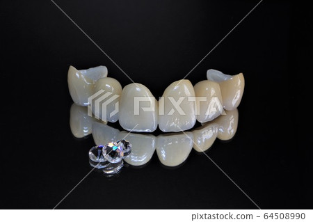 Have a beautiful white ceramic tooth by a dentist and welcome the new year with a smile Have a beautiful white ceramic tooth by a dentist and welcome the new year with a smile 64508990