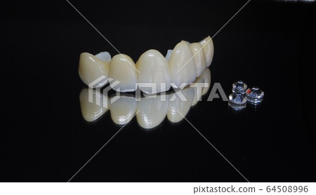 Have a beautiful white ceramic tooth by a dentist and welcome the new year with a smile Have a beautiful white ceramic tooth by a dentist and welcome the new year with a smile 64508996
