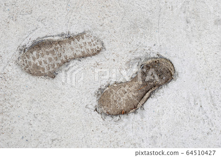 Human footprints on cement floors of walkway Human footprints on cement floors of walkway 64510427