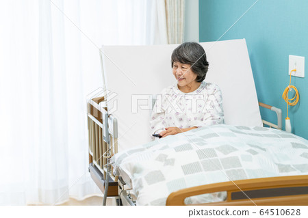Senior woman hospital room hospitalized medical image Senior woman hospital room hospitalized medical image 64510628