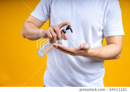 Asian man washing hands with alcohol gel or hand 64511281