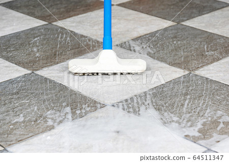 Cleaning the tile floor. Cleaning the tile floor. 64511347