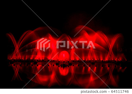 The colorful fountain dancing in celebration of year with dark night sky background. 64511746