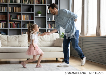 Gentleman father invites on dance little princess daughter 64516278