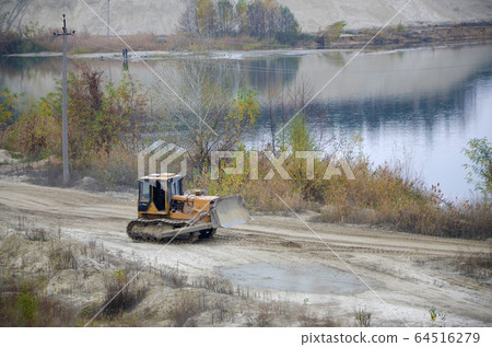 Quarry aggregate with heavy duty machinery. Quarry aggregate with heavy duty machinery. 64516279