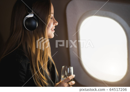 Attractive woman in private jet 64517206
