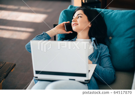 Woman talking to colleague on phone. Remote work Woman talking to colleague on phone. Remote work 64517870
