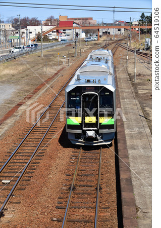 We photograph scenery of ordinary train departing and arriving at JR Yoichi station in spring Hokkaido 64519106