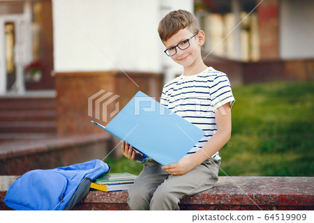 Pupil spend time in a school yard 64519909