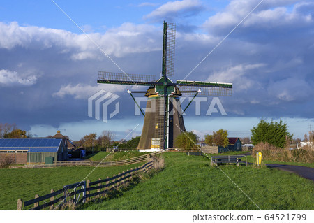 The historic Lisserpoel windmill along the river the Ringvaart 64521799