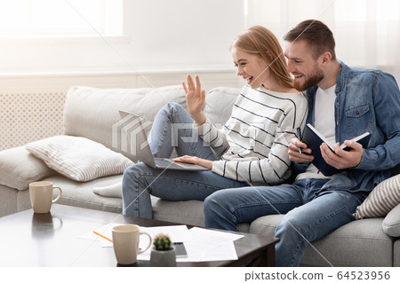 Self-isolated family talking with friends with online video call 64523956