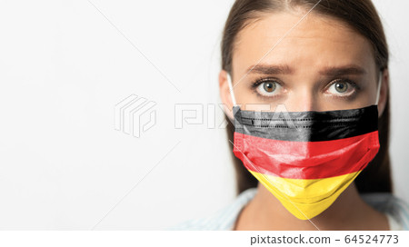 Woman In Medical Mask With German Flag, White Background, Panorama 64524773