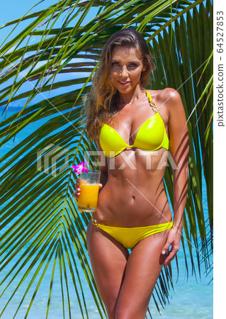Woman with cocktail 64527853