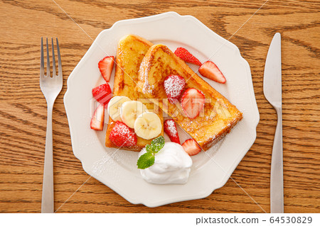 French toast with plenty of fruit 64530829