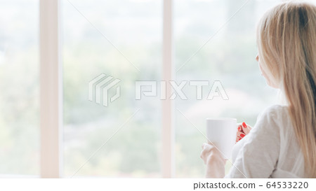 morning coffee pensive woman window mug hot drink 64533220