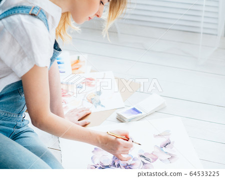 art hobby inspired woman sitting floor painting art hobby inspired woman sitting floor painting 64533225