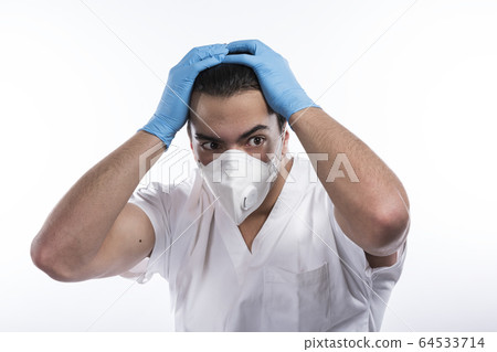 Young male nurse man in blue sterile gloves. A 64533714