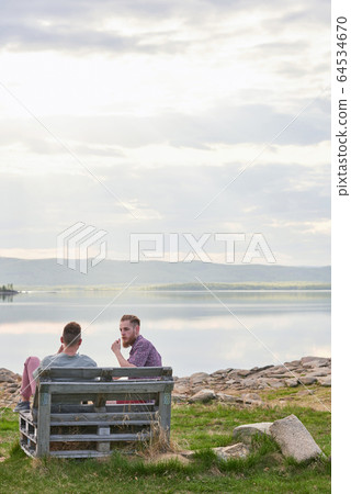 Friends Resting By Lake Friends Resting By Lake 64534670