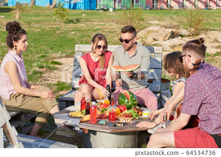 Friends Hanging Out Outdoors Friends Hanging Out Outdoors 64534736