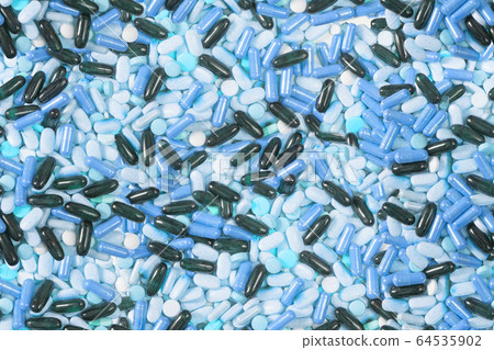 Many pills background 64535902