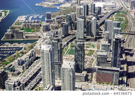 Toronto downtown and harbor aerial view from CN Tower. Toronto downtown and harbor aerial view from CN Tower. 64536073