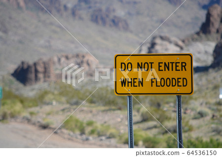 Do Not Enter When Flooded Sign on Route 66 in Mohave County, Arizona USA Do Not Enter When Flooded Sign on Route 66 in Mohave County, Arizona USA 64536150