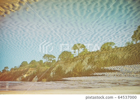 Creative reflection of seaside landscape with Creative reflection of seaside landscape with 64537000