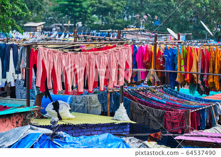 Dhobi Ghat is an open air laundromat lavoir in Mumbai, India with laundry drying on ropes Dhobi Ghat is an open air laundromat lavoir in Mumbai, India with laundry drying on ropes 64537490