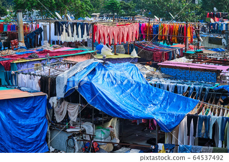 Dhobi Ghat is an open air laundromat lavoir in Mumbai, India with laundry drying on ropes Dhobi Ghat is an open air laundromat lavoir in Mumbai, India with laundry drying on ropes 64537492