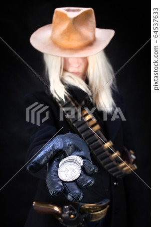 wild west blonde girl with silver dollars in hand wild west blonde girl with silver dollars in hand 64537633