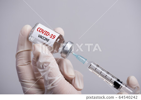 Female doctor hand wearing white grove and holding Female doctor hand wearing white grove and holding 64540242