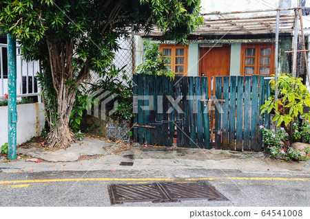 HongKong Shek o village street scenery at rainy day 64541008