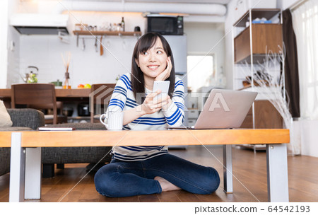 Remote work woman's home 64542193