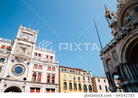 St Mark's Clock tower (Torre dell'Orologio) and Basilica di San Marco in Piazza San Marco, Venice, Italy 64542785