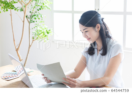 Business female desk work 64544759
