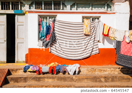Old house and hanging laundry in Mysore, India 64545547