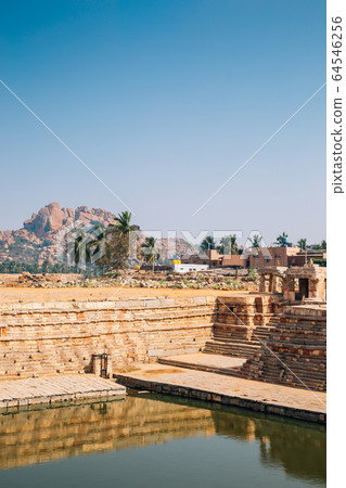 Manmatha Tank and exotic rocky mountain in Hampi, India 64546256