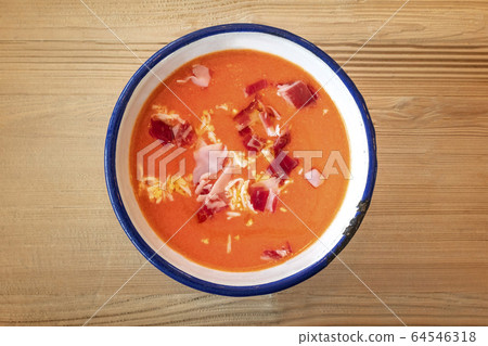 Salmorejo, Spanish cold tomato soup, shot from the top on a wooden background 64546318