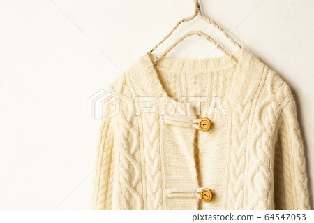 Light beige white thick cardigan on white background 64547053