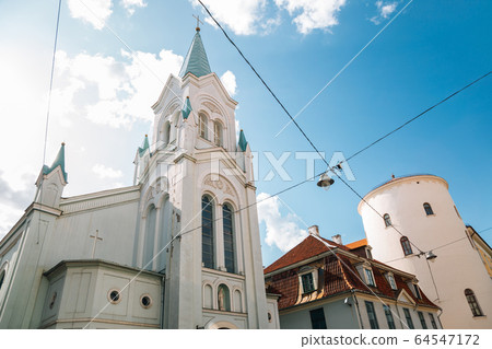 Our Lady of Sorrows Church and old town street in Riga, Latvia 64547172